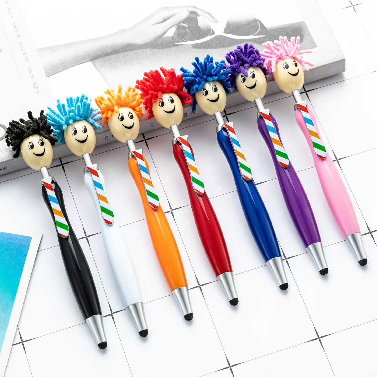 The ballpoint pen with cute doll-head